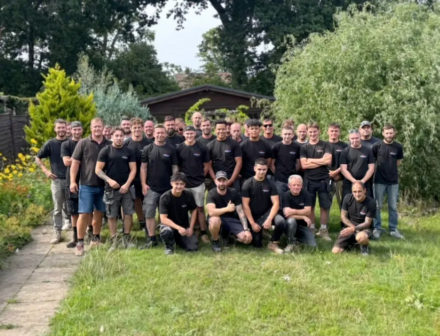 The Prestige Surrey team photographed together in a client garden